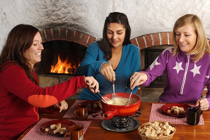 Culinary Tour from Zurich with Traditional Swiss Cheese Fondue Dinner - A sunset table above Lake Zurich