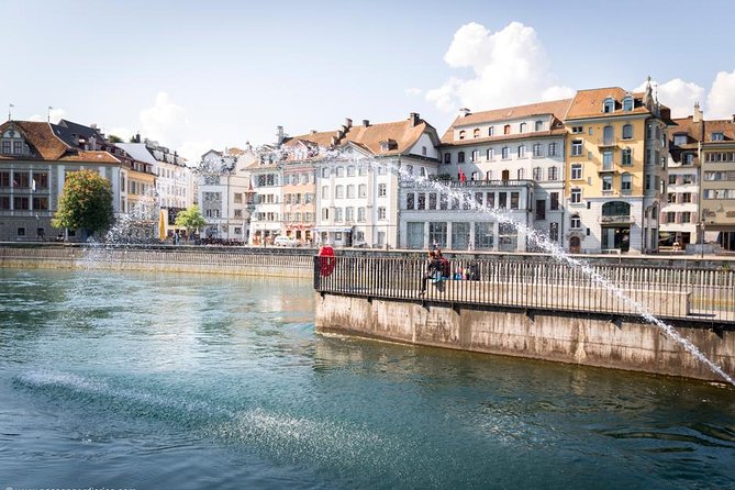 Lucerne Walking & Boat Tour: The Best Swiss Experience - The bridge details and Swiss symbols