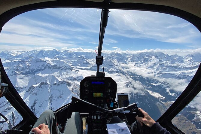 Private Swiss Alps helicopter tour over snow covered mountain peaks and glaciers - The Eiger north face and Grindelwald Valley