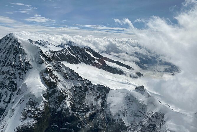 Private Swiss Alps helicopter tour over snow covered mountain peaks and glaciers - Lake Thun and Lake Brienz from the air