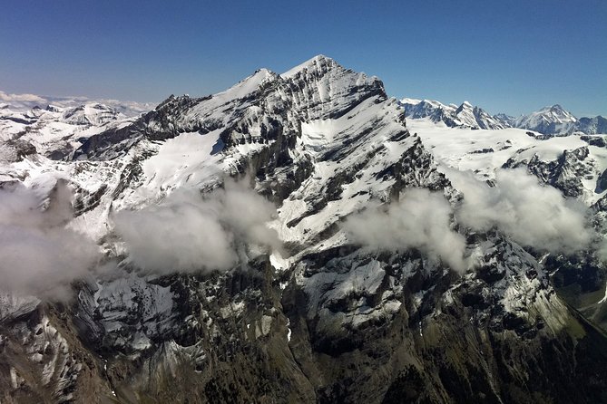 Private Swiss Alps helicopter tour over snow covered mountain peaks and glaciers - What the cabin experience is like