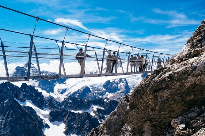 Swiss Alps & Mount Titlis Private Glacier Experience - Reaching the summit on Titlis Rotair