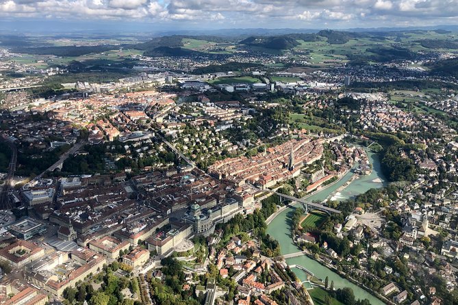 Swiss Capital city helicopter sightseeing tour - the ideal flight to see Berne - Parliament rising above the Aare