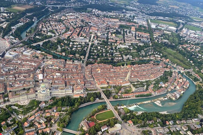 Swiss Capital city helicopter sightseeing tour - the ideal flight to see Berne - Bern Münster and the old town below