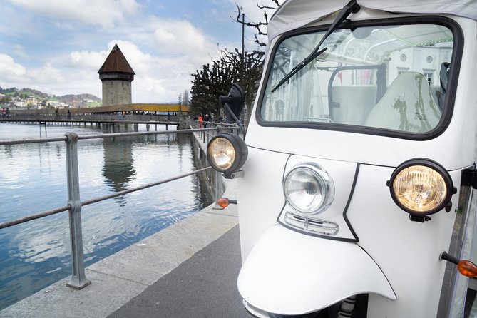 The heart of Lucerne with the Etuktuk - Chapel Bridge, Lucerne’s essential photo stop