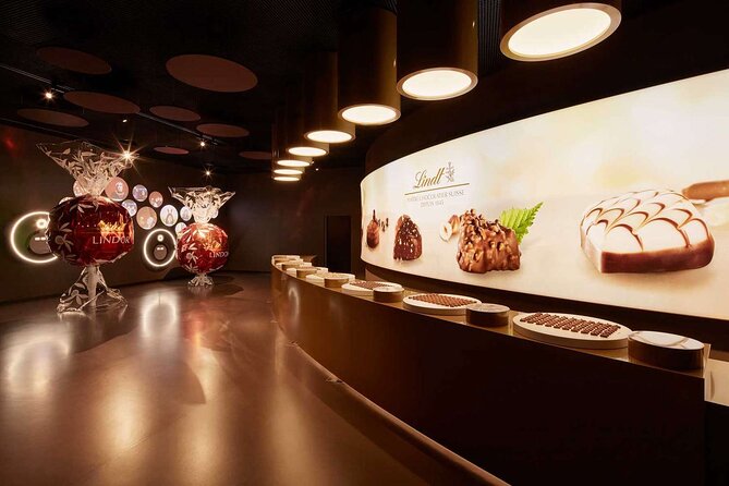 Tour in Lindt Home of Chocolate Museum From Zurich With pickup - Watching chocolate production through panoramic windows