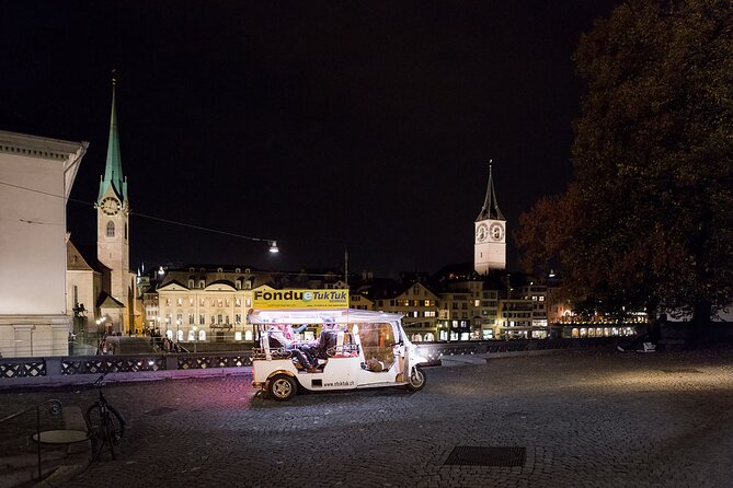 Zurich eTukTuk Private Tour - with Cheese Fondue and Wine - Limmatquai, water views, and city light